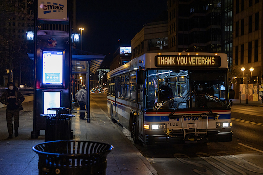 downtown Columbus Ohio bus stop, 'thank you veterans' on bus marquee